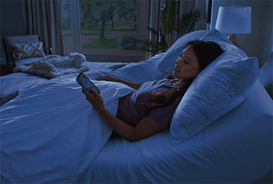 A woman looking at her sleeptracker app