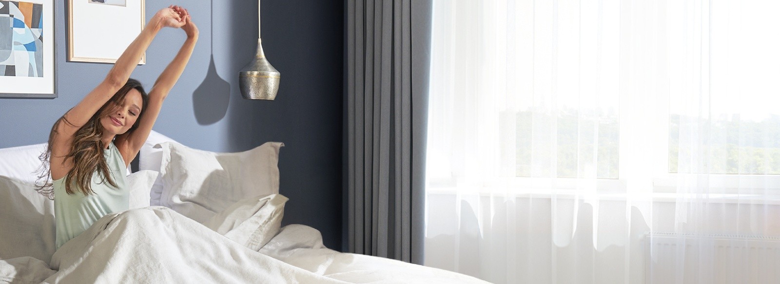 Woman stretching after a great night of sleep on her Tempur-Pedic mattress