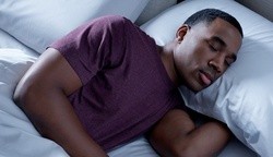 A man sleeping on a Breeze mattress.