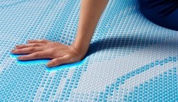 Hand pressing on a Breeze cooling cover