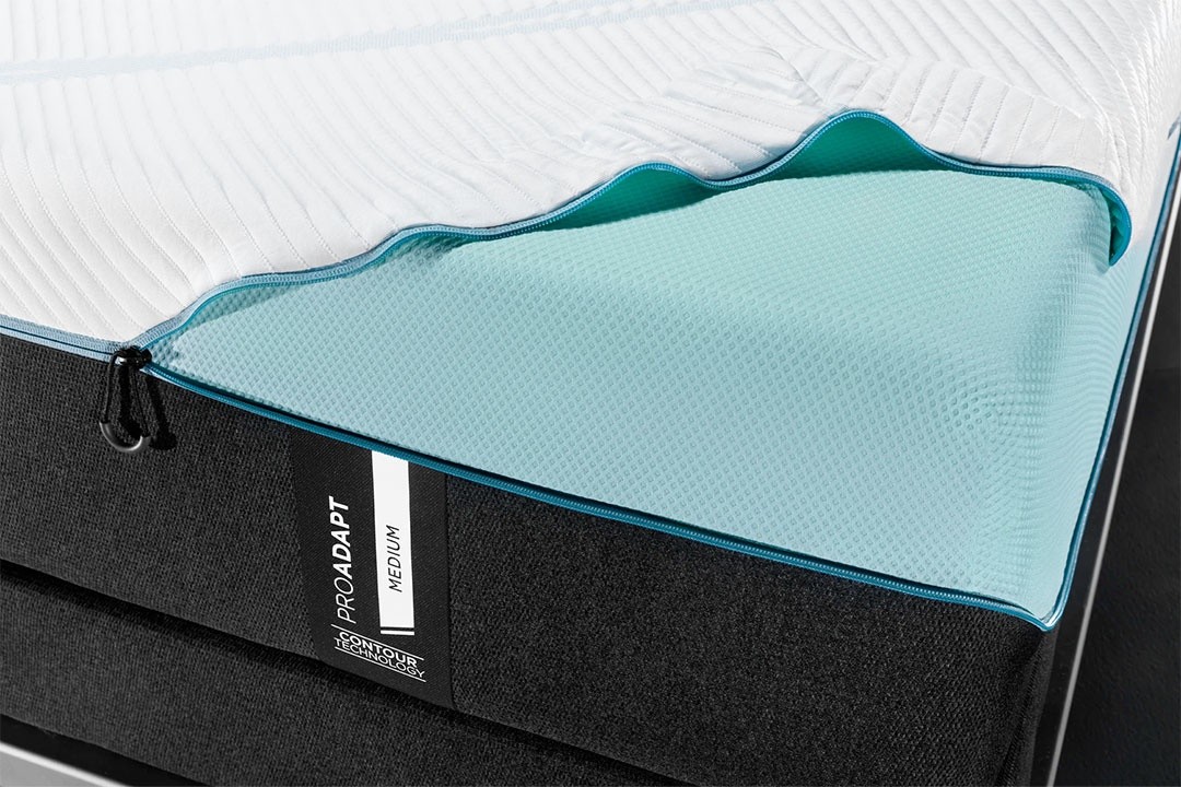 the ProAdapt Medium top cover slightly unzipped from the corner of the mattress