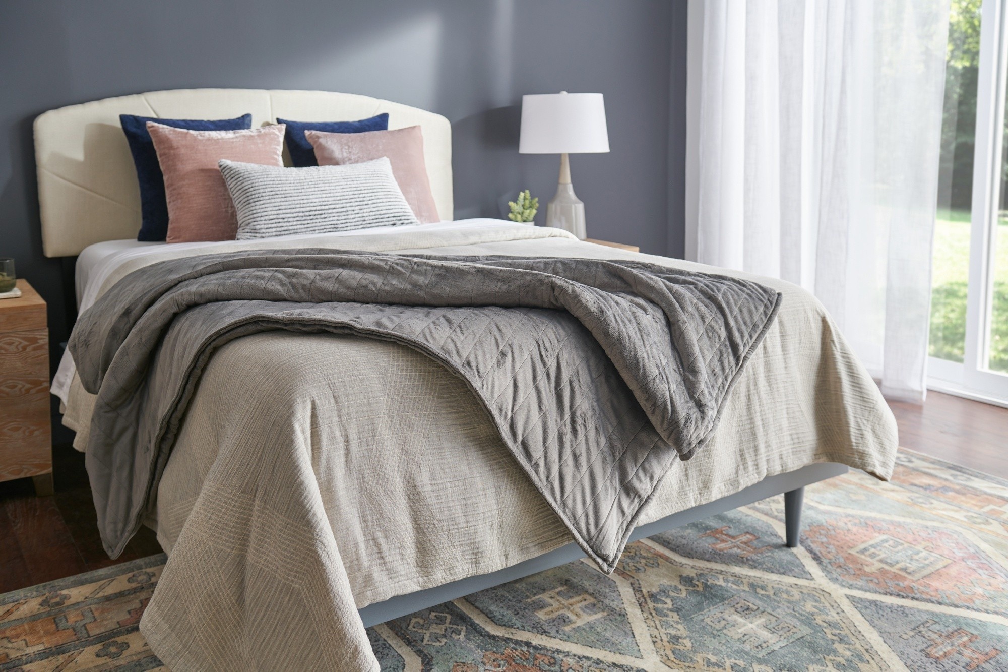 TP Weighted Blanket on a dressed bed